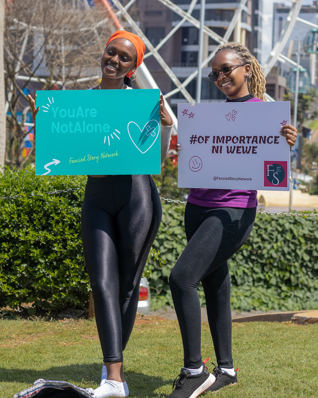 Two women holding FSN campaign signs